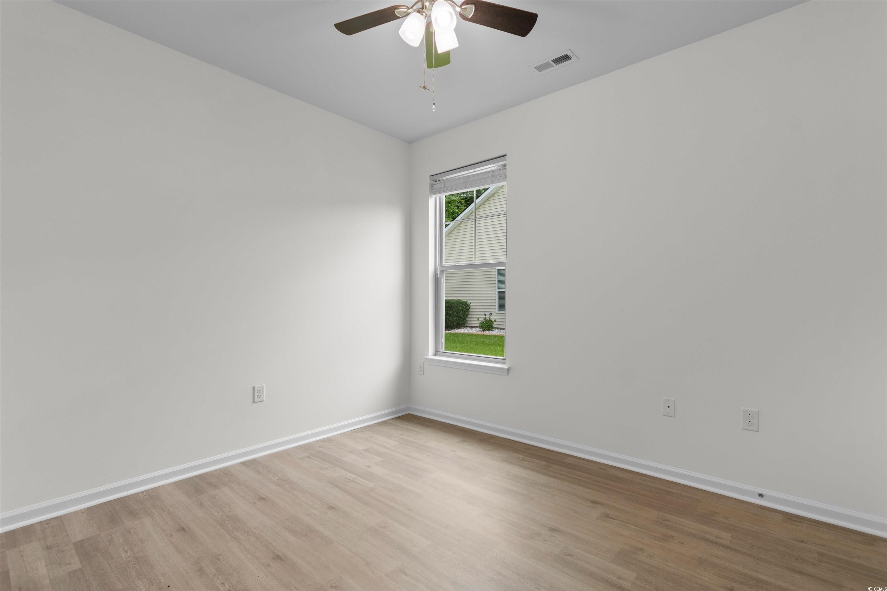 124 Shady Arbor Loop Longs, SC 29568 - Photo 23 of 40 Empty room with light wood finished floors and ceiling fan
