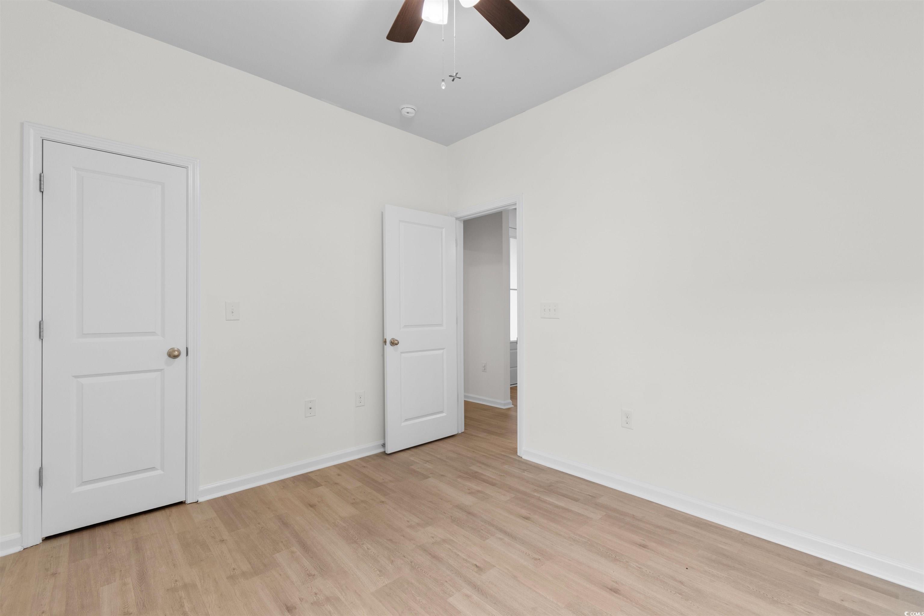 124 Shady Arbor Loop Longs, SC 29568 - Photo 24 of 40 Unfurnished bedroom featuring light wood finished floors and ceiling fan