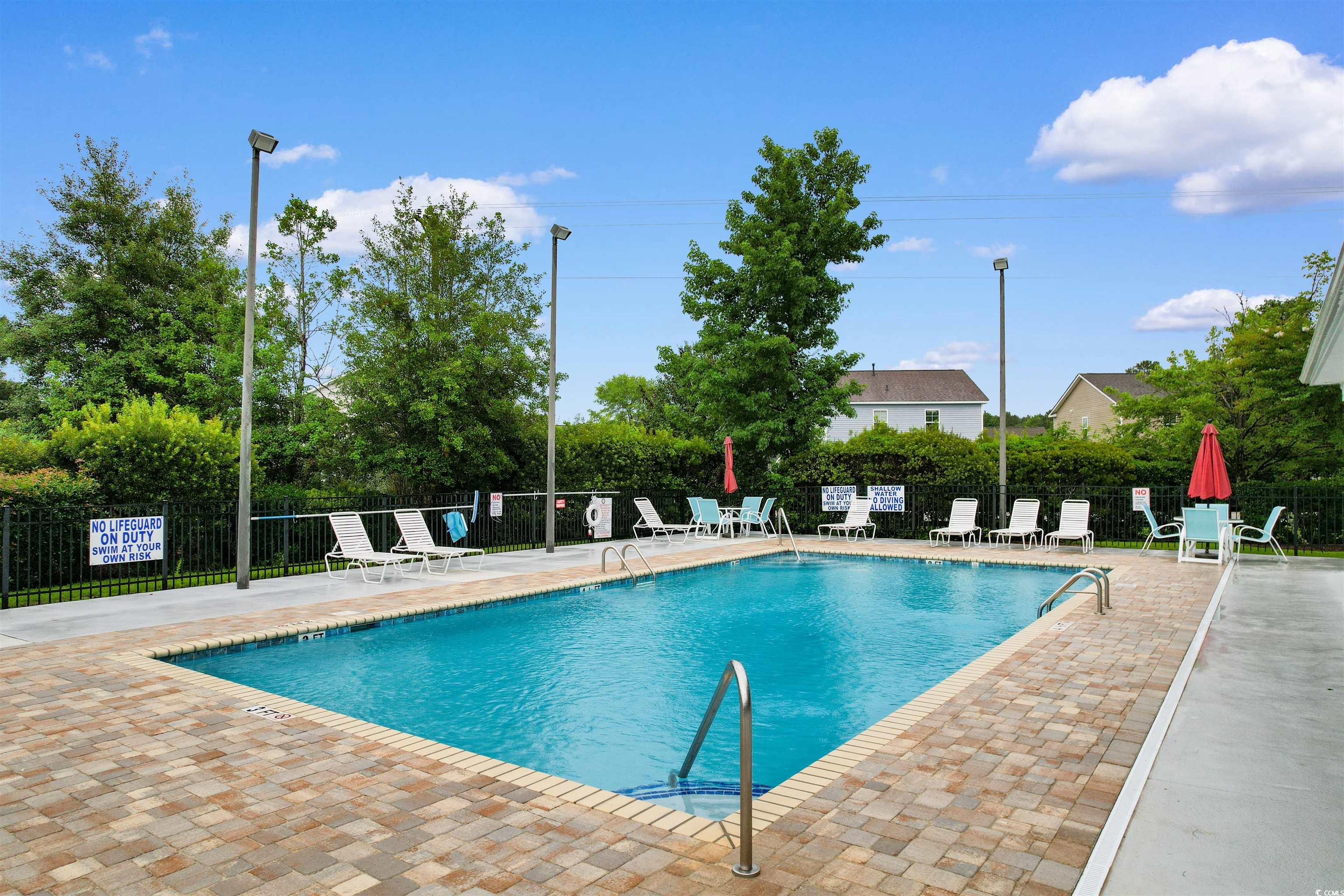 124 Shady Arbor Loop Longs, SC 29568 - Photo 33 of 40 Community pool with a patio