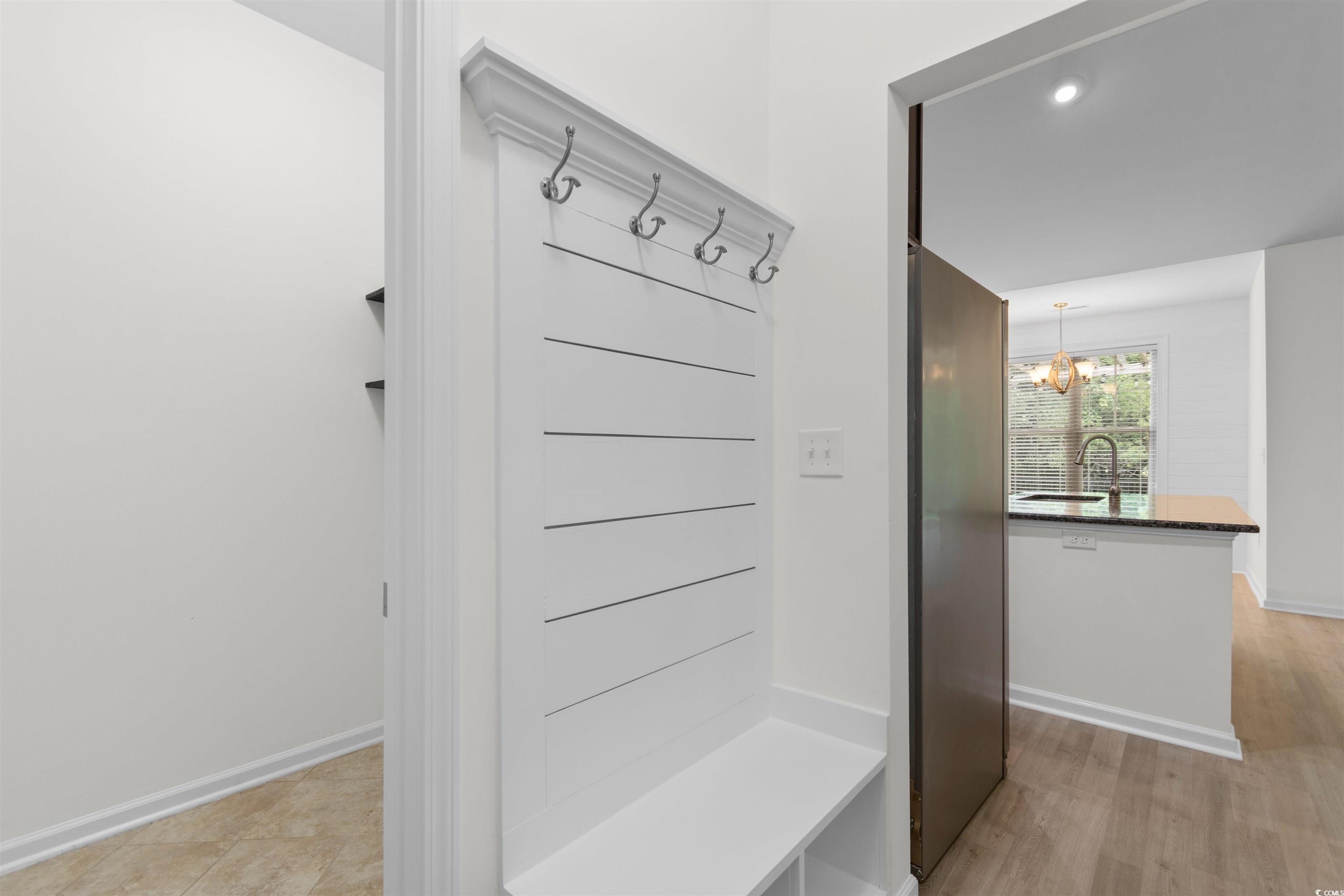 124 Shady Arbor Loop Longs, SC 29568 - Photo 10 of 40 Mudroom featuring a chandelier and light wood-style floors