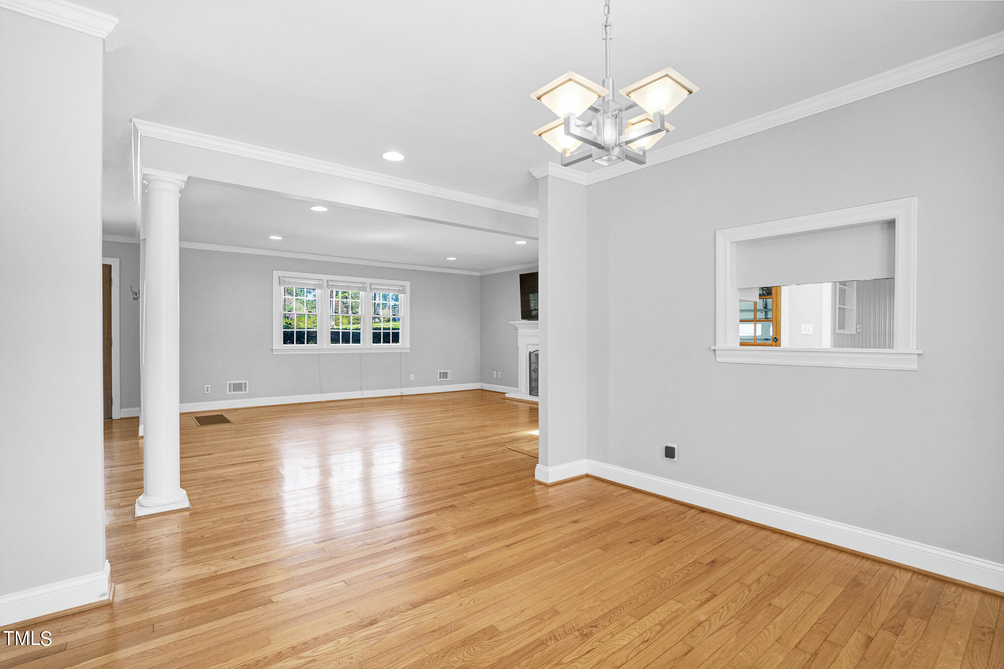 4501 Boxwood Road Raleigh, NC 27612 - Photo 18 of 44 a view of an empty room with wooden floor and a window