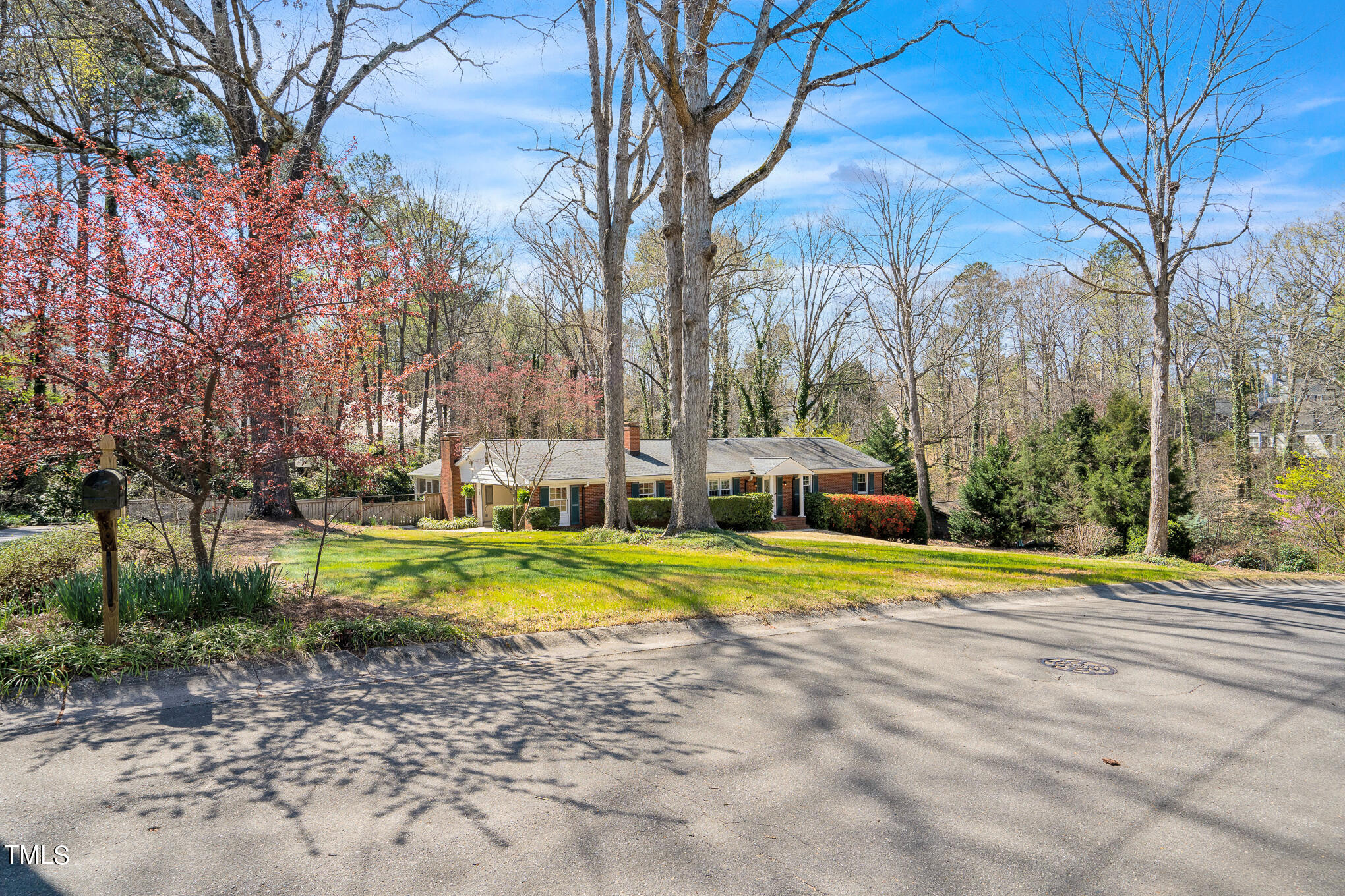 4501 Boxwood Road Raleigh, NC 27612 - Photo 2 of 44 a view of a house with a yard and large trees