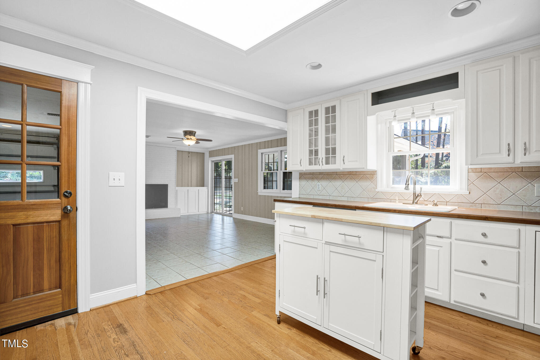 4501 Boxwood Road Raleigh, NC 27612 - Photo 23 of 44 a kitchen with white cabinets and sink