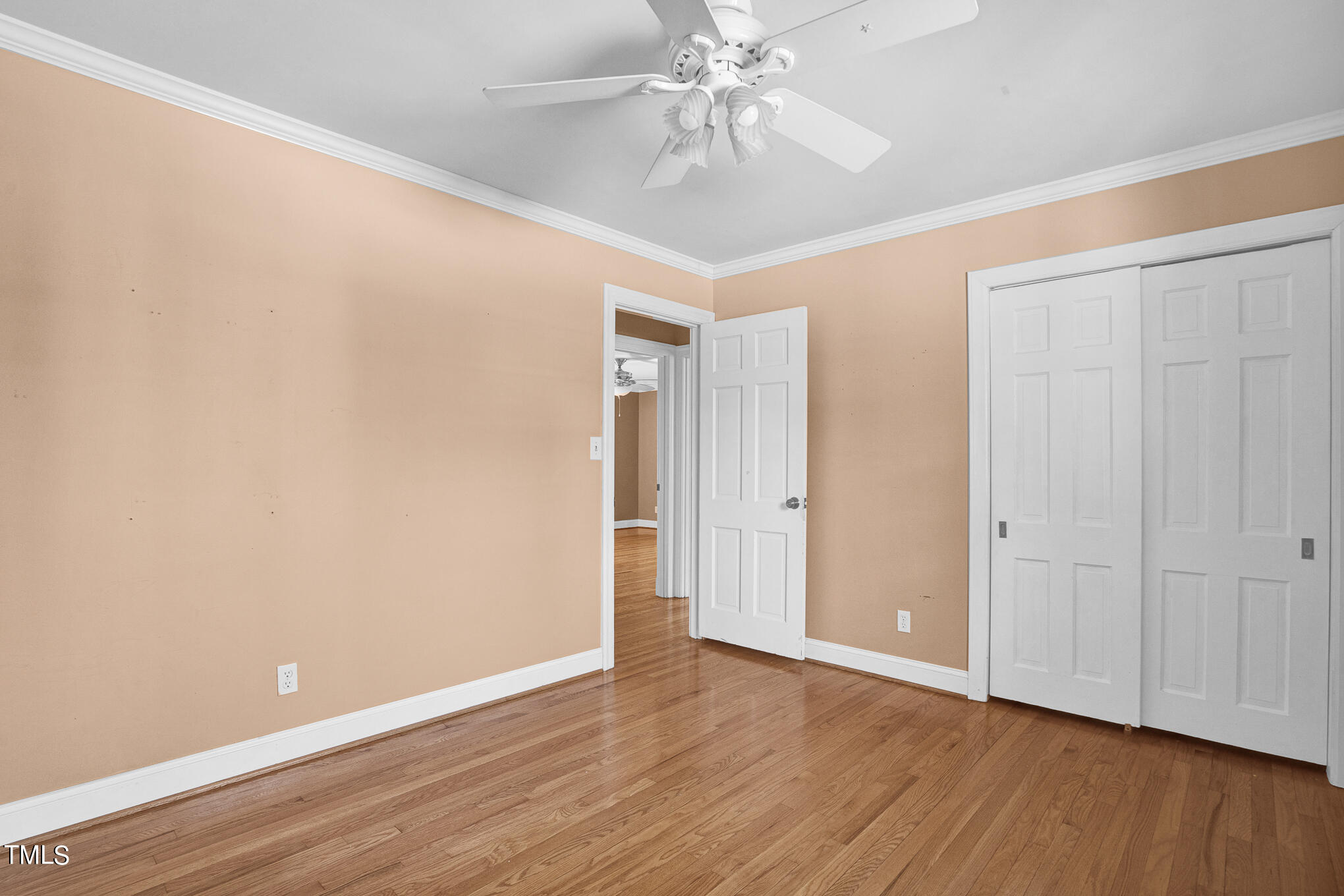 4501 Boxwood Road Raleigh, NC 27612 - Photo 24 of 44 a view of an empty room with wooden floor
