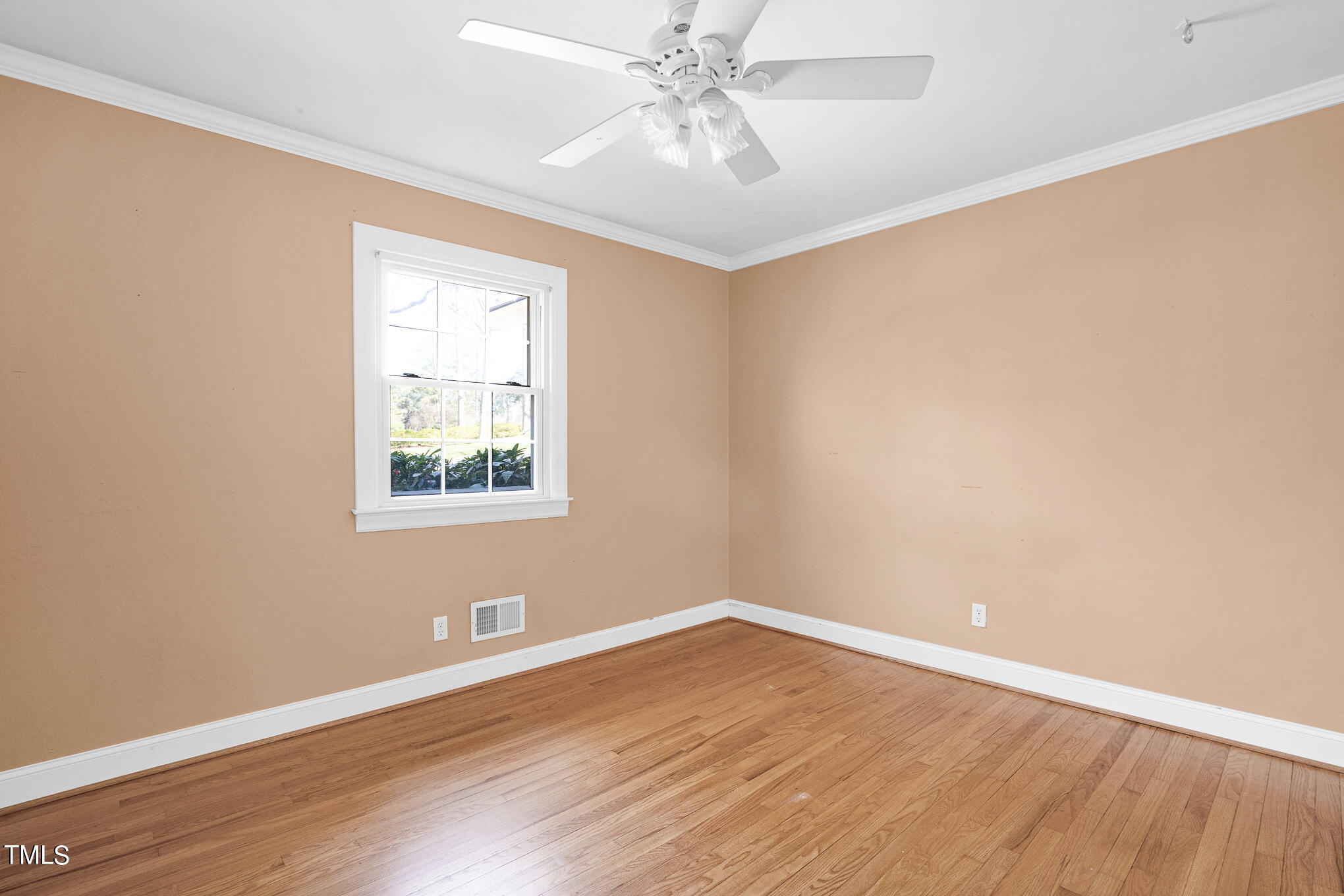 4501 Boxwood Road Raleigh, NC 27612 - Photo 25 of 44 wooden floor in an empty room with a window