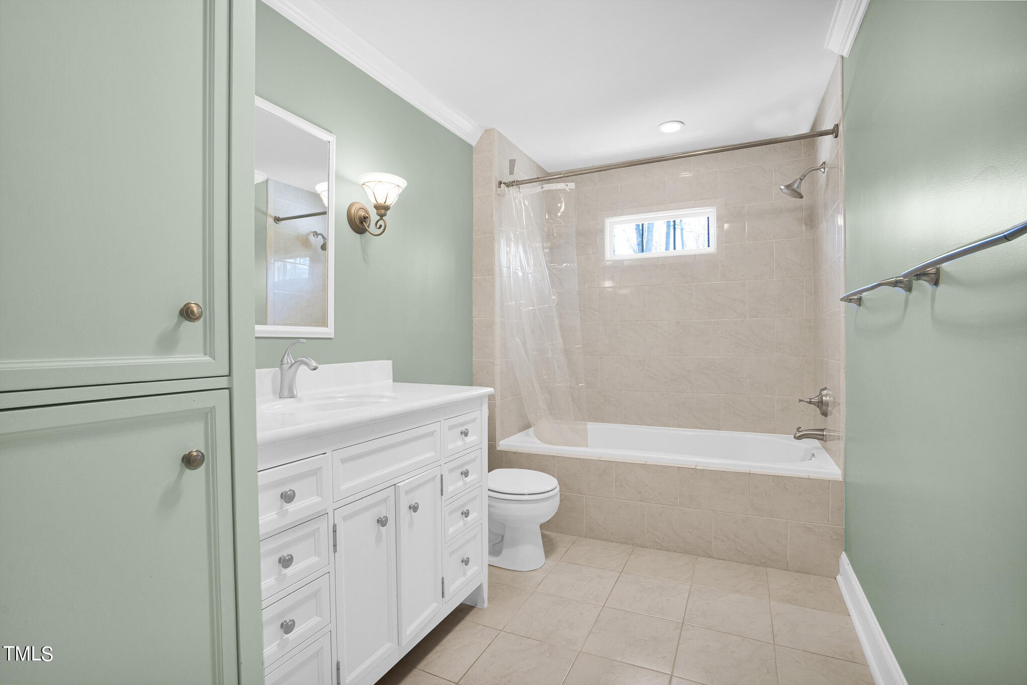 4501 Boxwood Road Raleigh, NC 27612 - Photo 26 of 44 a bathroom with a bathtub shower sink mirror and toilet