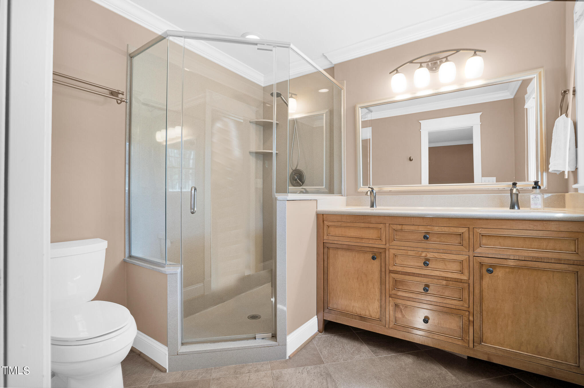 4501 Boxwood Road Raleigh, NC 27612 - Photo 31 of 44 a bathroom with a granite countertop sink toilet mirror and shower