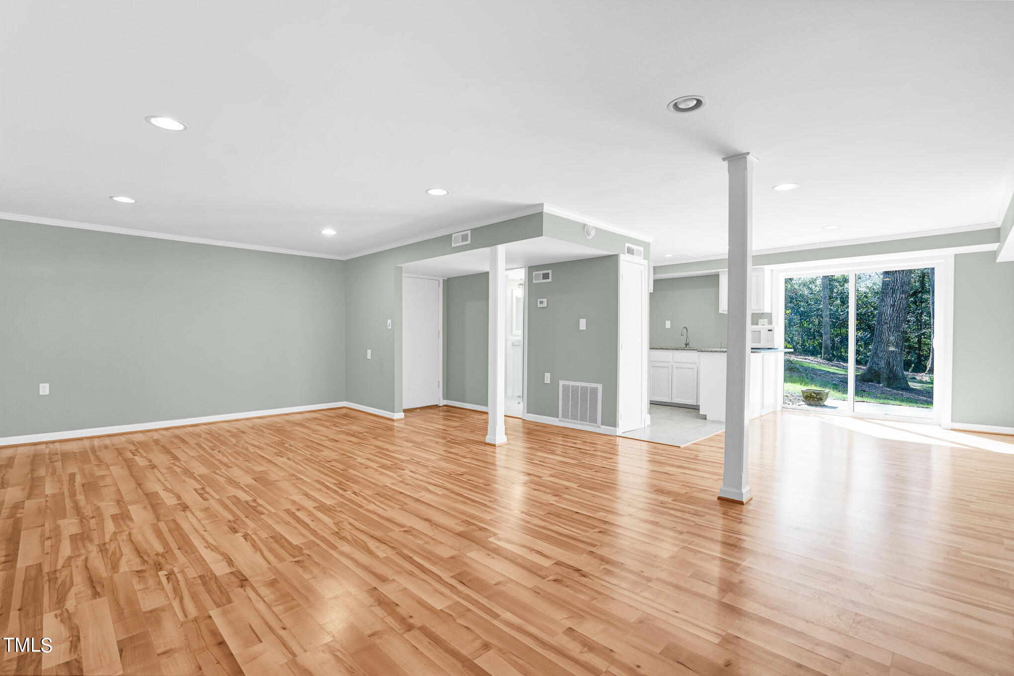 4501 Boxwood Road Raleigh, NC 27612 - Photo 38 of 44 a view of empty room with wooden floor and fan