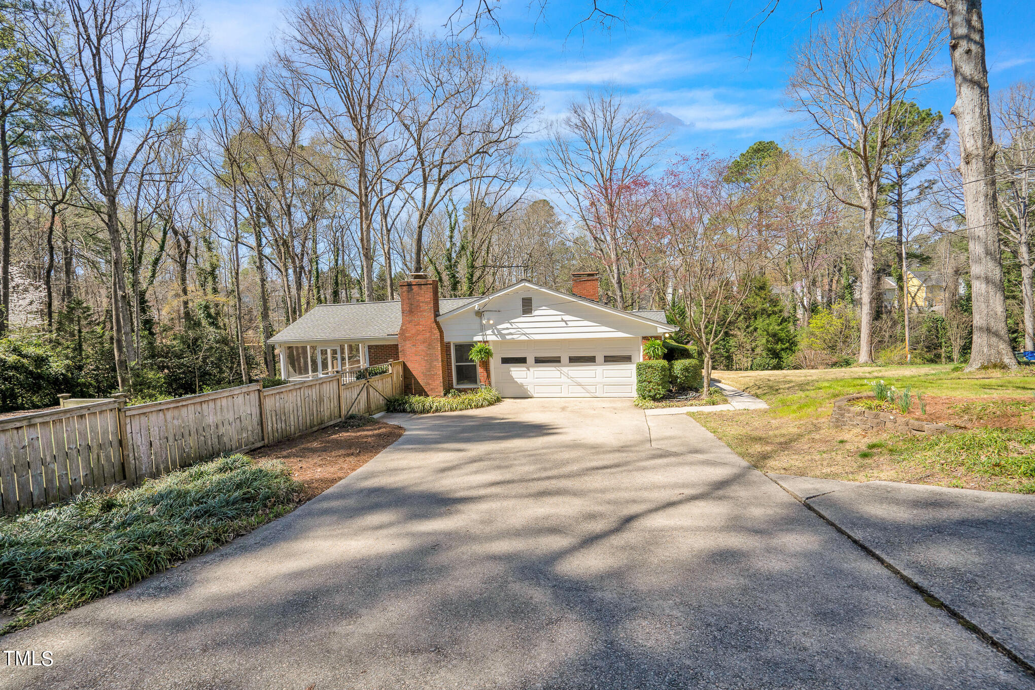 4501 Boxwood Road Raleigh, NC 27612 - Photo 4 of 44 a view of residential house with tree and wooden fence