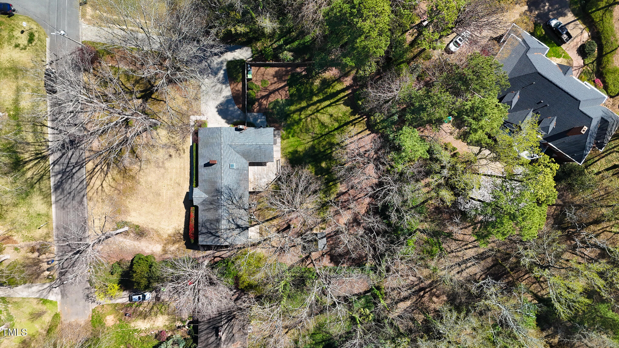 4501 Boxwood Road Raleigh, NC 27612 - Photo 43 of 44 a backyard of a house with lots of green space
