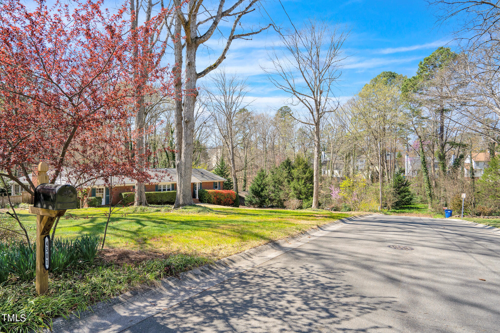 4501 Boxwood Road Raleigh, NC 27612 - Photo 44 of 44 a view of a house with a yard and large trees