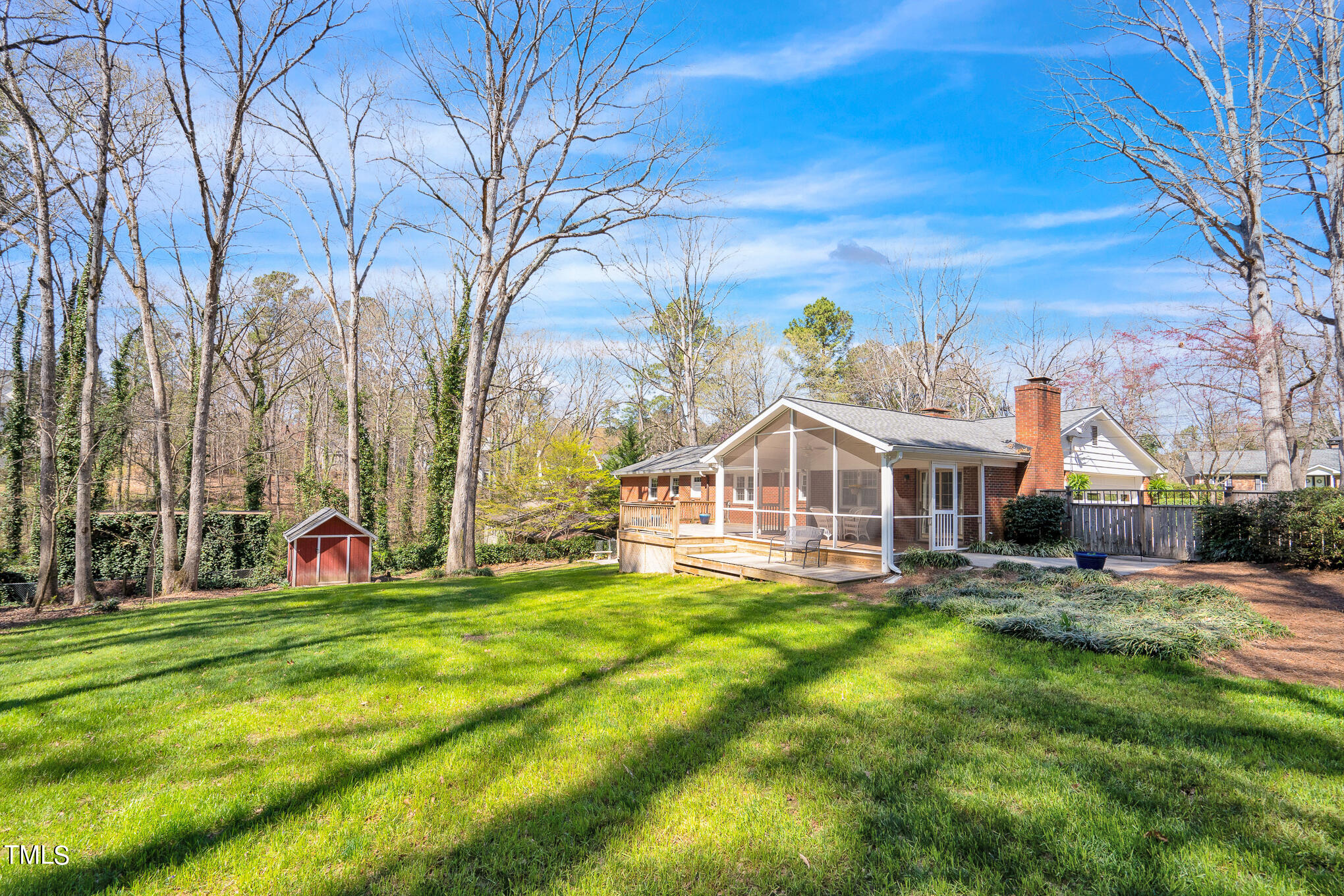 4501 Boxwood Road Raleigh, NC 27612 - Photo 6 of 44 a view of a house with a big yard and large trees