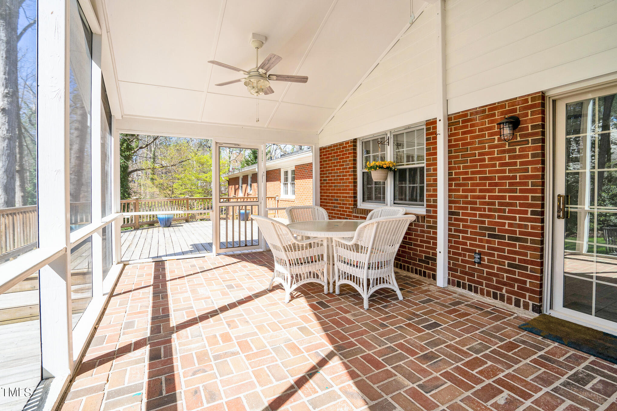 4501 Boxwood Road Raleigh, NC 27612 - Photo 10 of 44 a dining room with furniture a chandelier and wooden floor