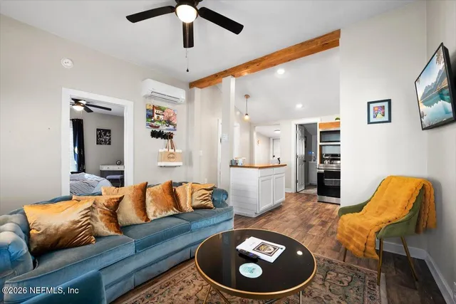 a living room with furniture and windows