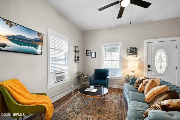 a view of a dining room with furniture and window