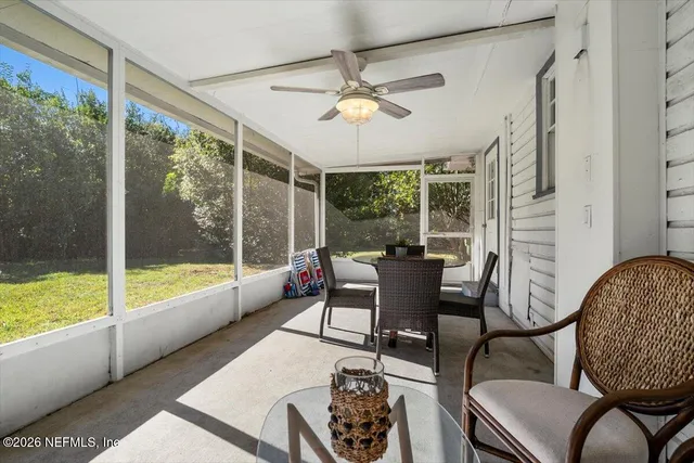 a view of a backyard with large trees