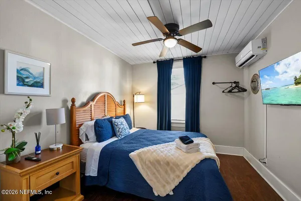 a bathroom with a toilet a sink and a mirror