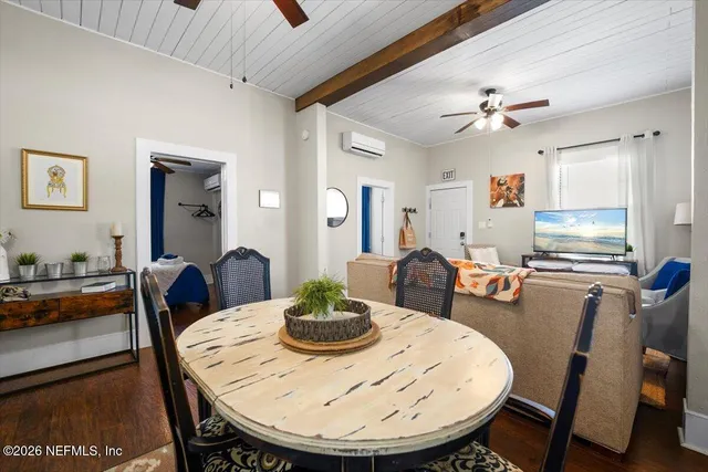 a living room with furniture fireplace and window