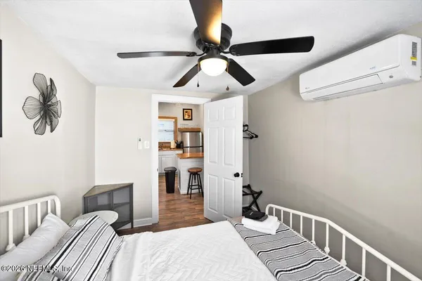 a bedroom with a bed and window