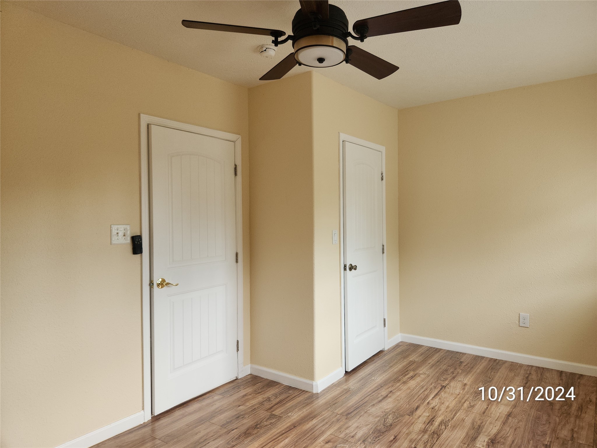 703 North Avenue B Freeport, TX 77541 - Photo 12 of 14 a view of a room with wooden floor closet and windows