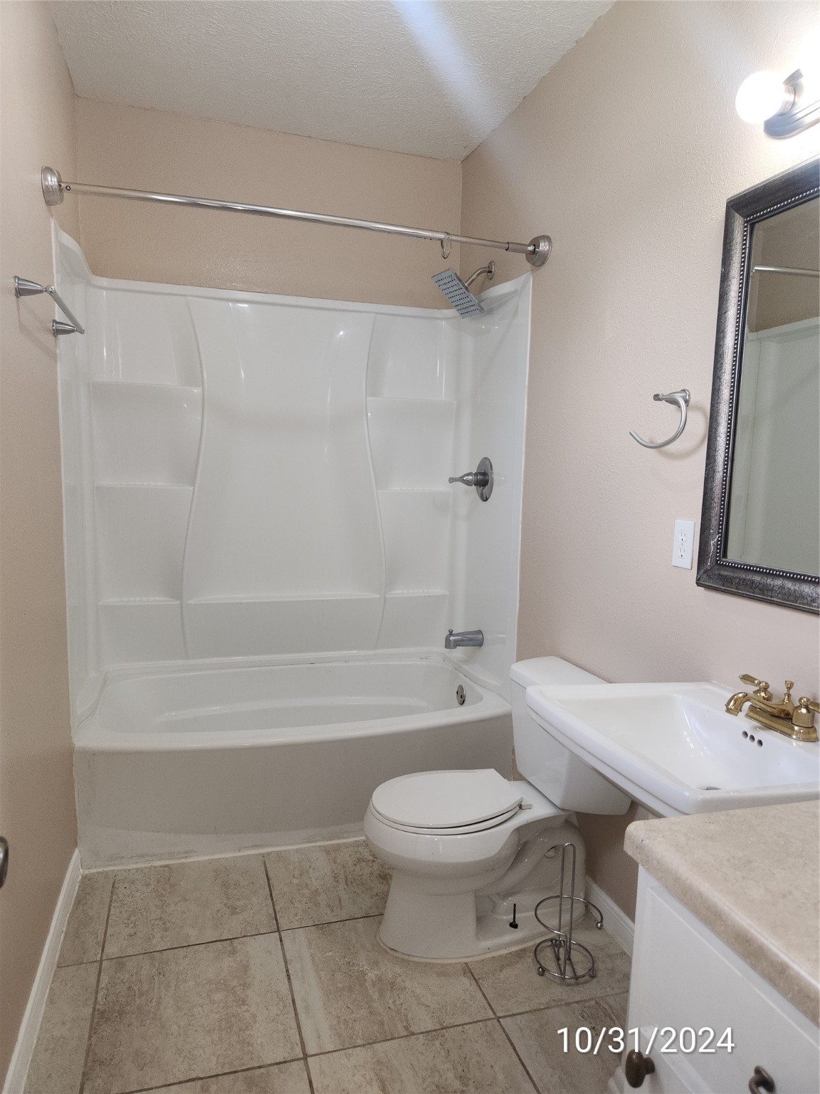 703 North Avenue B Freeport, TX 77541 - Photo 8 of 14 a bathroom with a sink toilet and shower