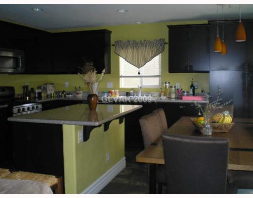 255 Soggy Ruff Way Las Vegas, NV 89148 - Photo 2 of 12 Property Photo. Island kitchen with granite countertops, stainless appliances & slate floors