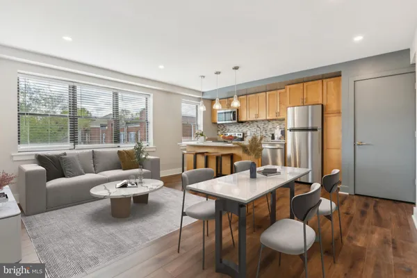 a living room with furniture and a table
