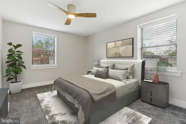 a bedroom with a large bed and a window