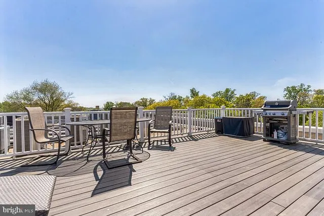 a view of roof deck with patio