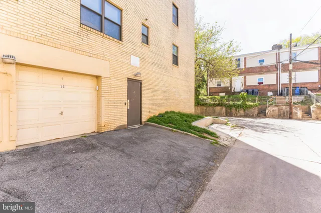 a view of a street with a building in the background