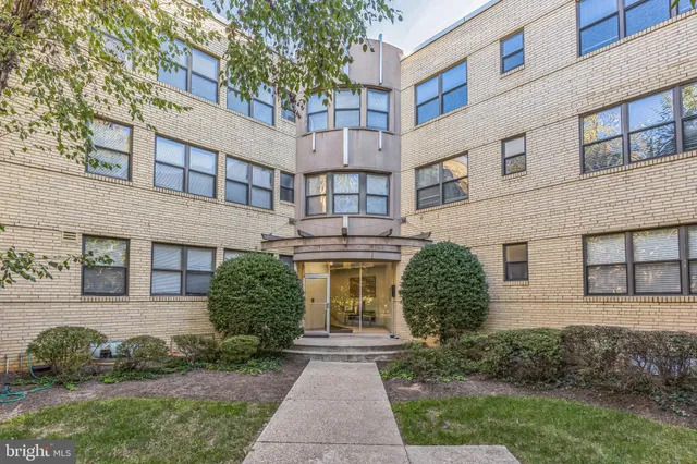 front view of a house with a garden