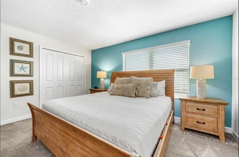 a bedroom with a bed and a cabinets