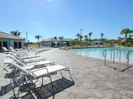a view of a lake with outdoor seating space