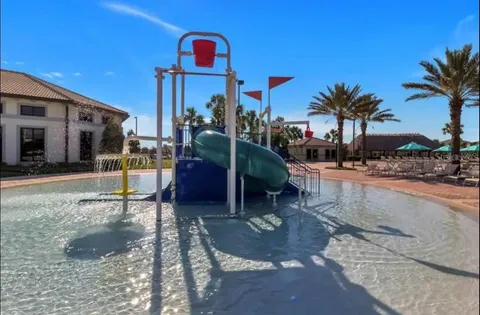 a kitchen with stainless steel appliances kitchen island granite countertop a sink and cabinets