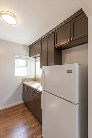 a kitchen with stainless steel appliances granite countertop a refrigerator sink and cabinets