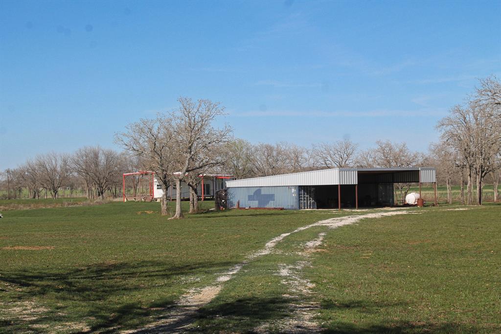1070 Paradise Oaks Perrin, TX 76486 - Photo 13 of 18 a view of a house with a yard and a large tree