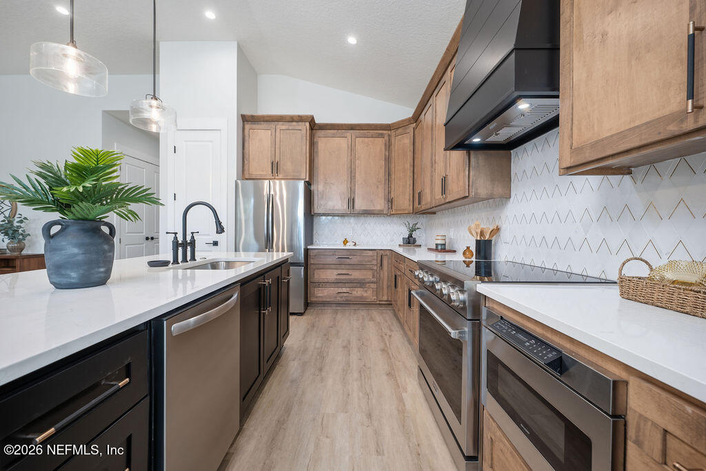 2747 Anchor Road Middleburg, FL 32068 - Photo 11 of 26 a kitchen with a sink a counter space cabinets and appliances