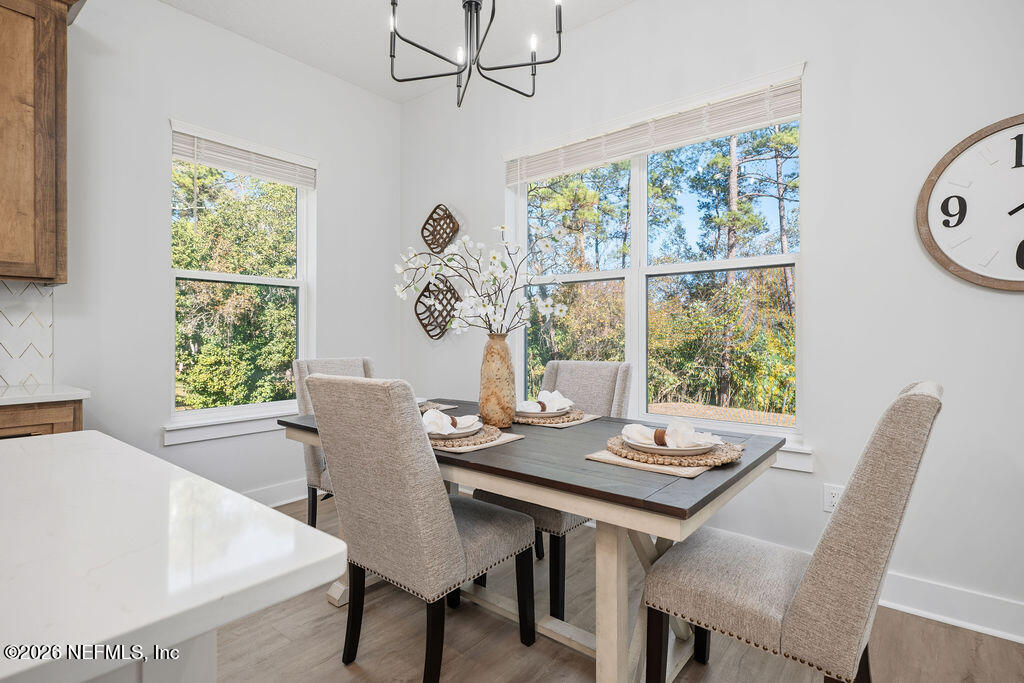 2747 Anchor Road Middleburg, FL 32068 - Photo 13 of 26 a view of a dining room with furniture window and outside view
