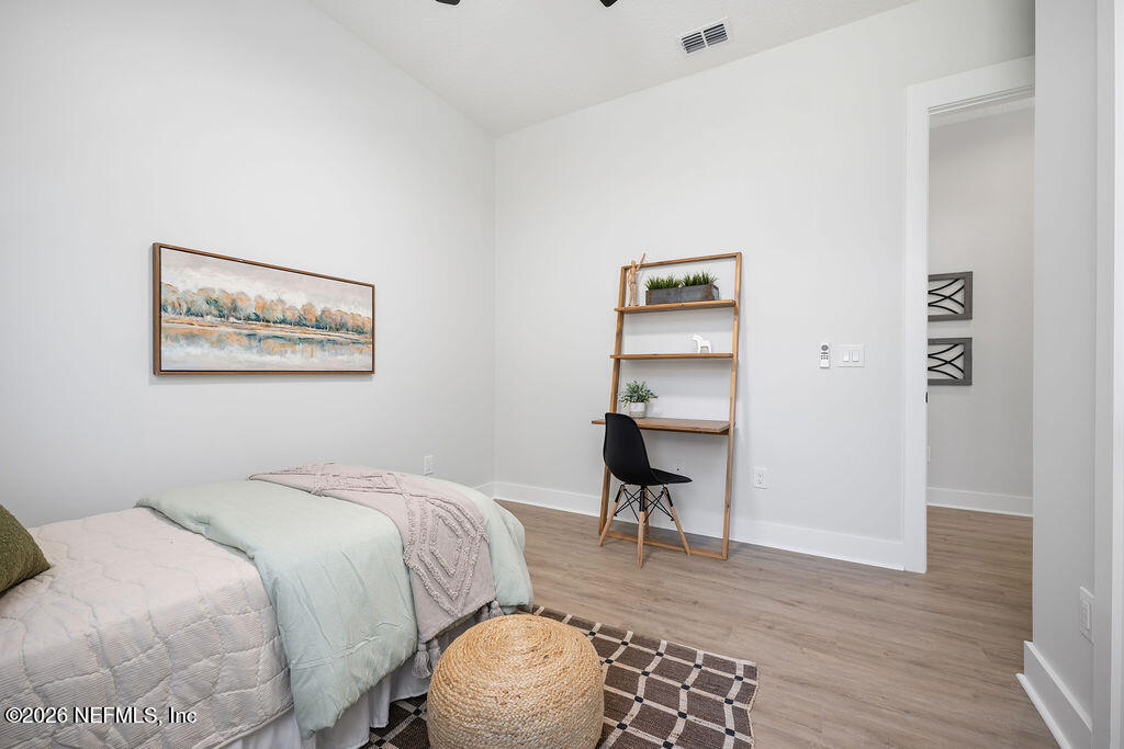 2747 Anchor Road Middleburg, FL 32068 - Photo 19 of 26 a bedroom with a bed and a table