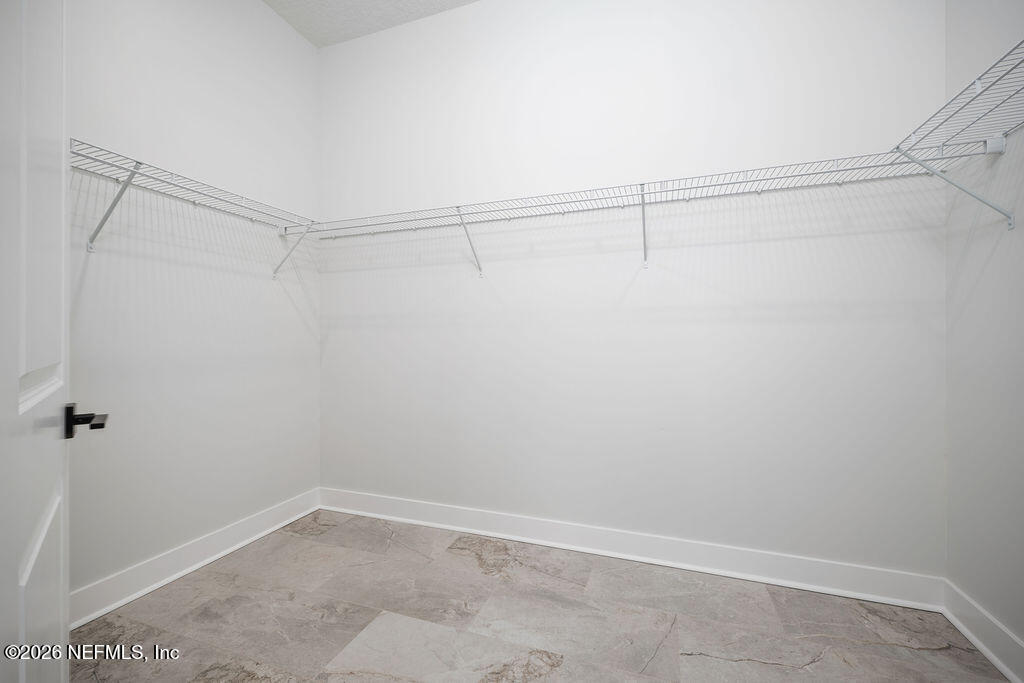 2747 Anchor Road Middleburg, FL 32068 - Photo 23 of 26 a view of a room with racks on the wall