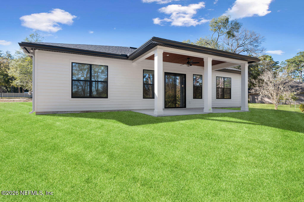 2747 Anchor Road Middleburg, FL 32068 - Photo 25 of 26 a front view of a house with a yard