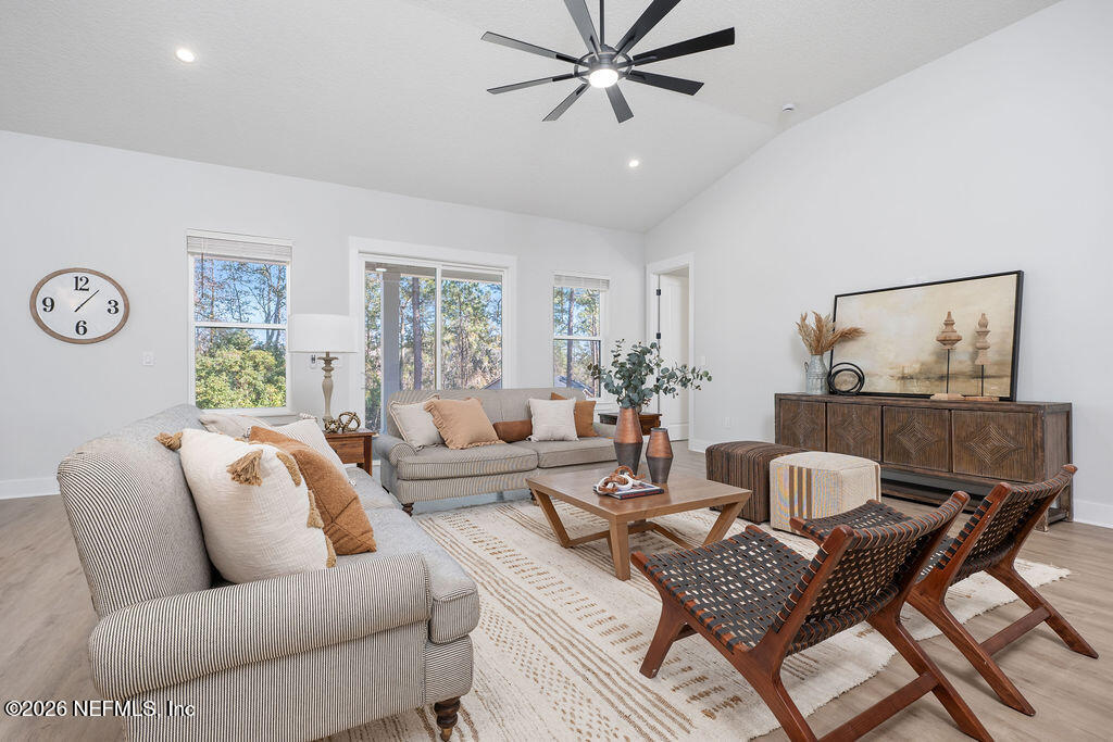 2747 Anchor Road Middleburg, FL 32068 - Photo 8 of 26 a living room with furniture and a large window