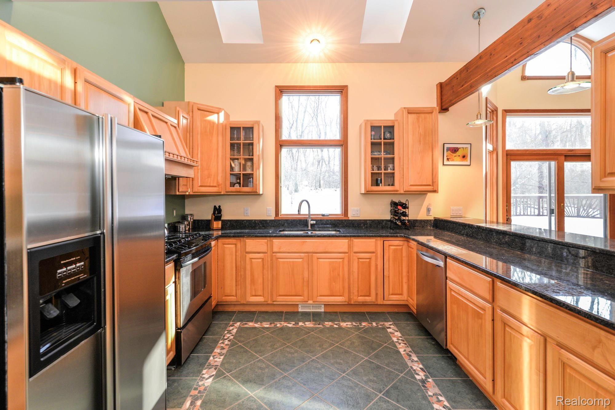 7844 Winans Lake Road Brighton, MI 48116 - Photo 13 of 38 20 Foot Ceilings in Kitchen with Beautiful Natural Lighting