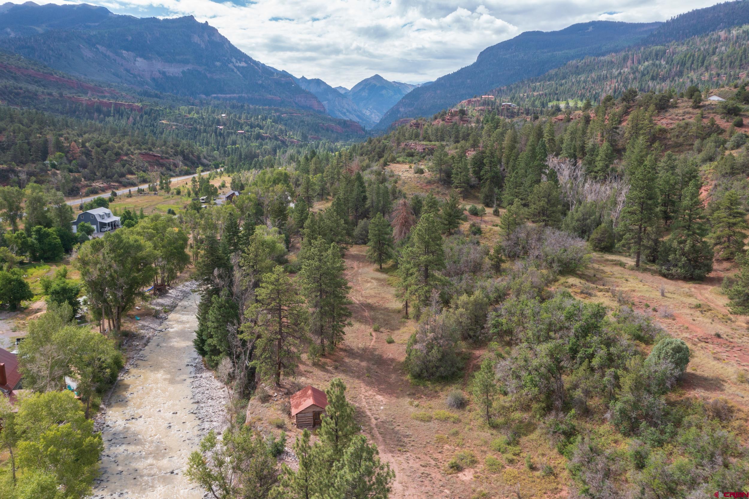 23 County Road 23 Ridgway, CO 81432 - Photo 3 of 9 a view of a forest with mountains and valleys in the background