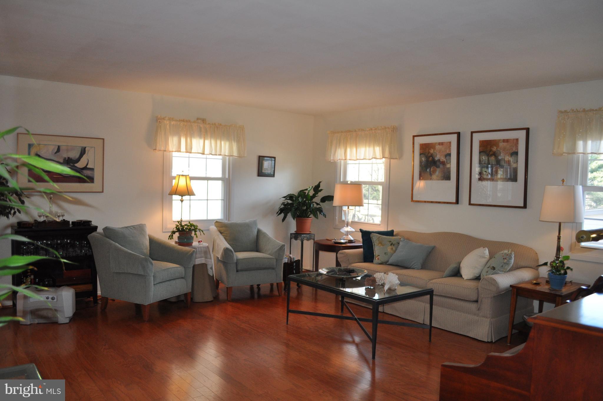 5159 Downwest Ride Columbia, MD 21044 - Photo 3 of 23 a living room with furniture wooden floor and a large window