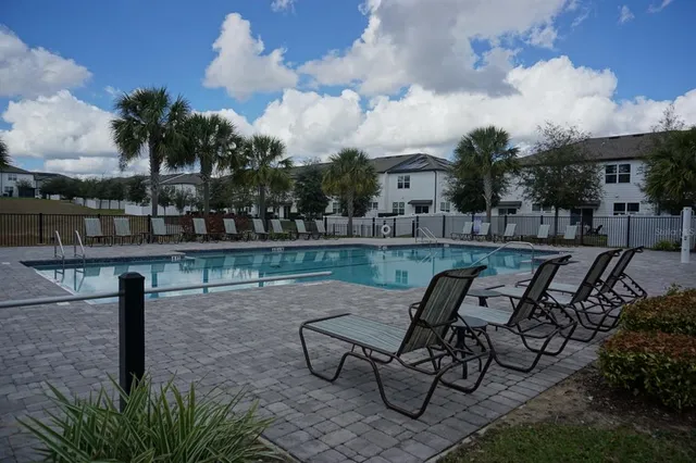 a view of a lake with outdoor seating