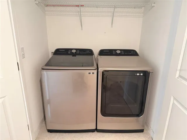 a utility room with dryer and washer