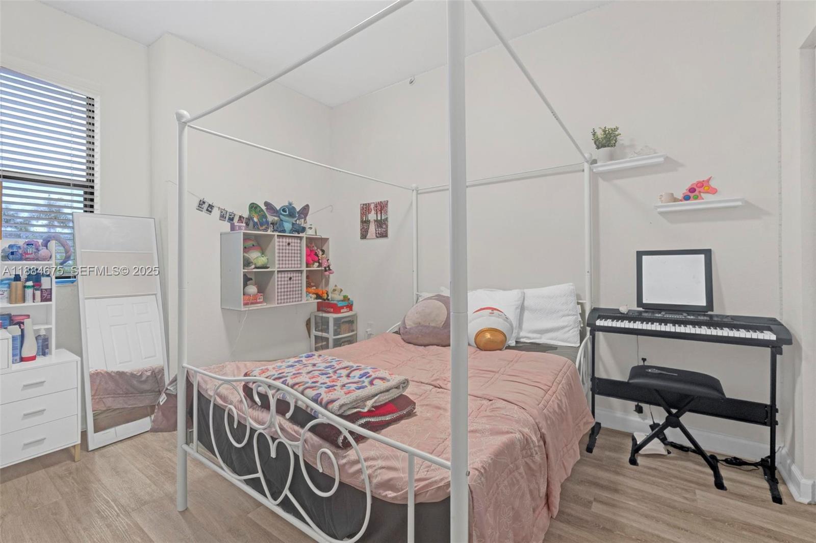 11413 Southwest 253rd Street, Unit 11413 Homestead, FL 33032 - Photo 15 of 44 a bedroom with a bed and a table in it