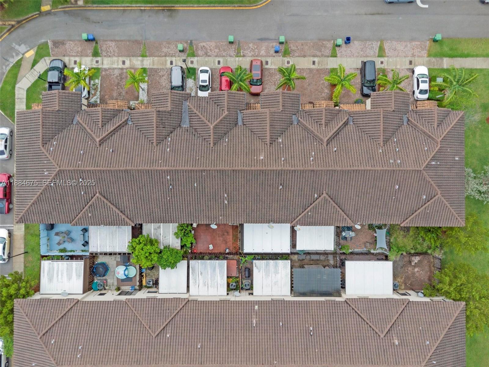 11413 Southwest 253rd Street, Unit 11413 Homestead, FL 33032 - Photo 32 of 44 an aerial view of a house with a yard