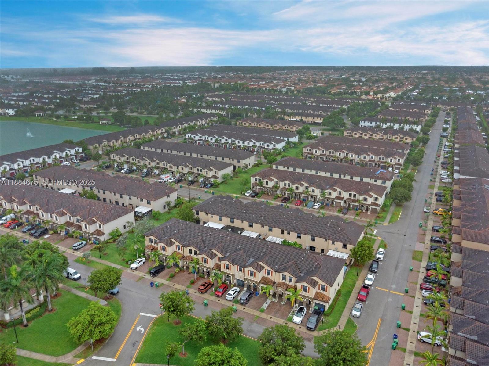 11413 Southwest 253rd Street, Unit 11413 Homestead, FL 33032 - Photo 36 of 44 an aerial view of city and lake